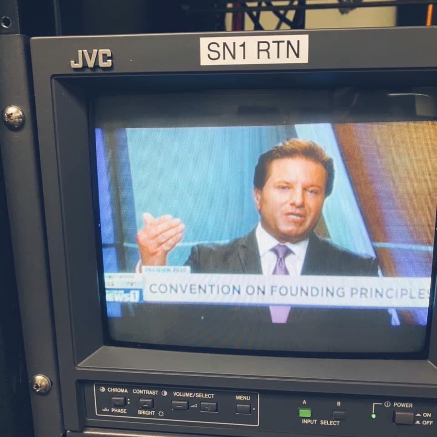 Brian Calfano on a studio preview monitor during Spectrum News 1's Convention on Founding Principles coverage