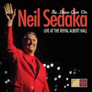 Cover of The Show Goes On, Live